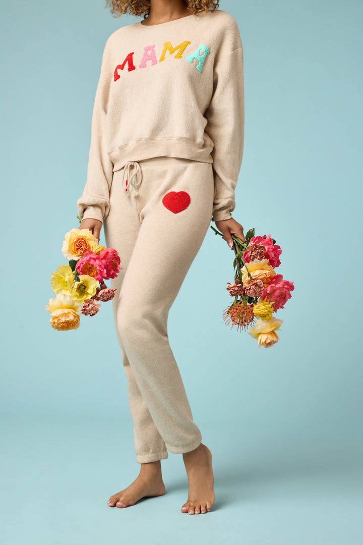 Women's oatmeal jogger pant with red boucle heart applique. Oatmeal cloud terry with tie waist.