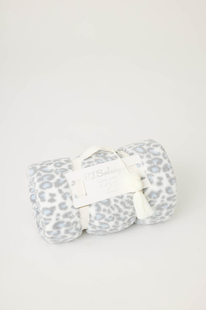 Reversible blanket in grey-white leopard print. Personal size blanket with carry strap.