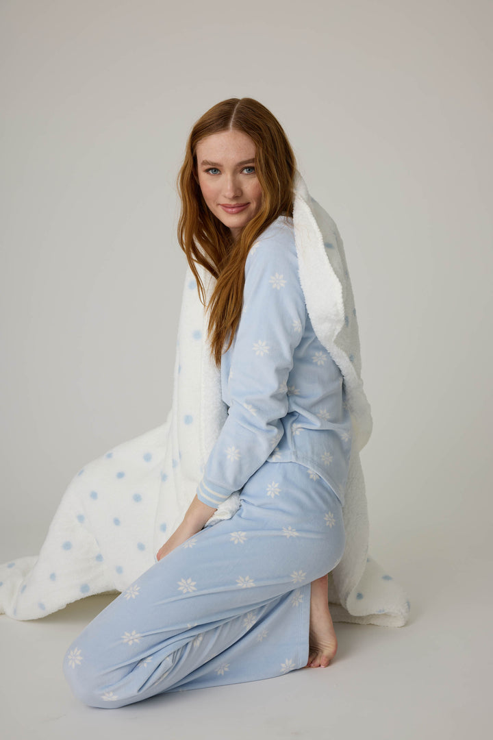 Reversible blanket in ivory polka dot print. Personal size blanket with carry strap.