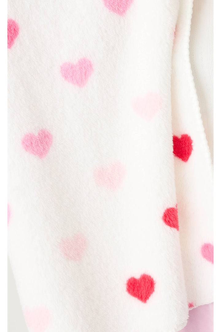 Plush ivory blanket with pink heart pattern.