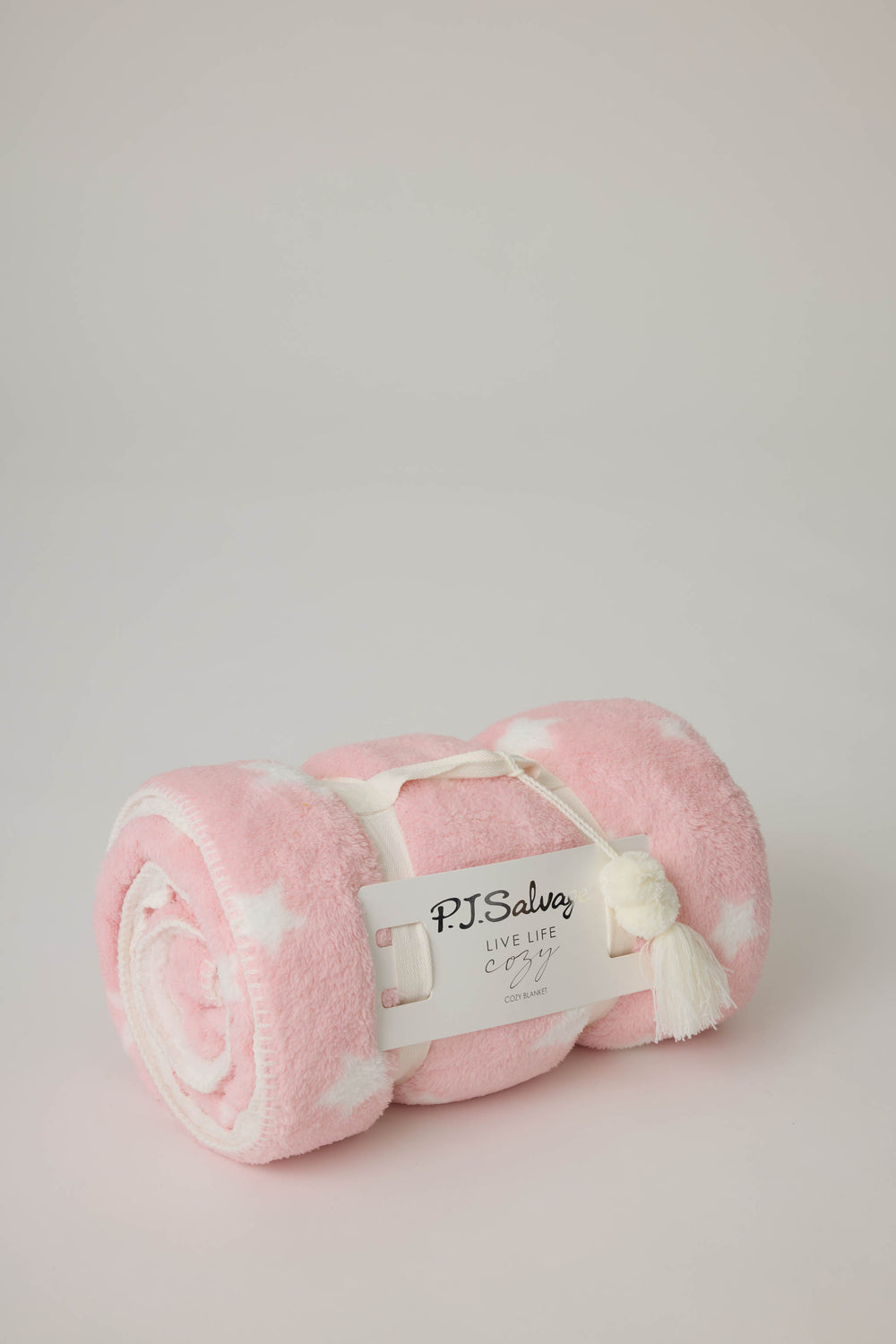Reversible blanket in pink-white star print. Personal size blanket with carry strap.