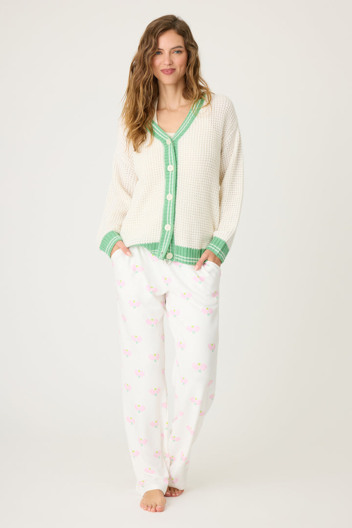Women's ivory cardigan sweater in textured knit with green stripes. Button front with two front patch pockets.