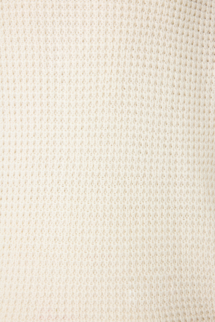 Women's ivory cardigan sweater in textured knit with green stripes. Button front with two front patch pockets.