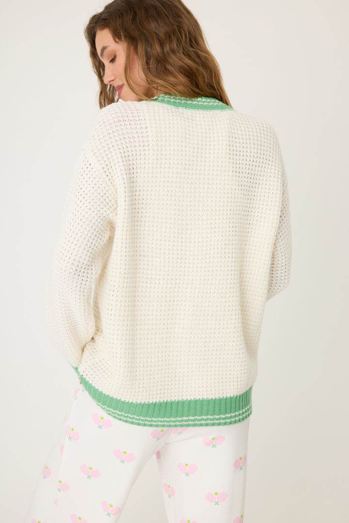 Women's ivory cardigan sweater in textured knit with green stripes. Button front with two front patch pockets.