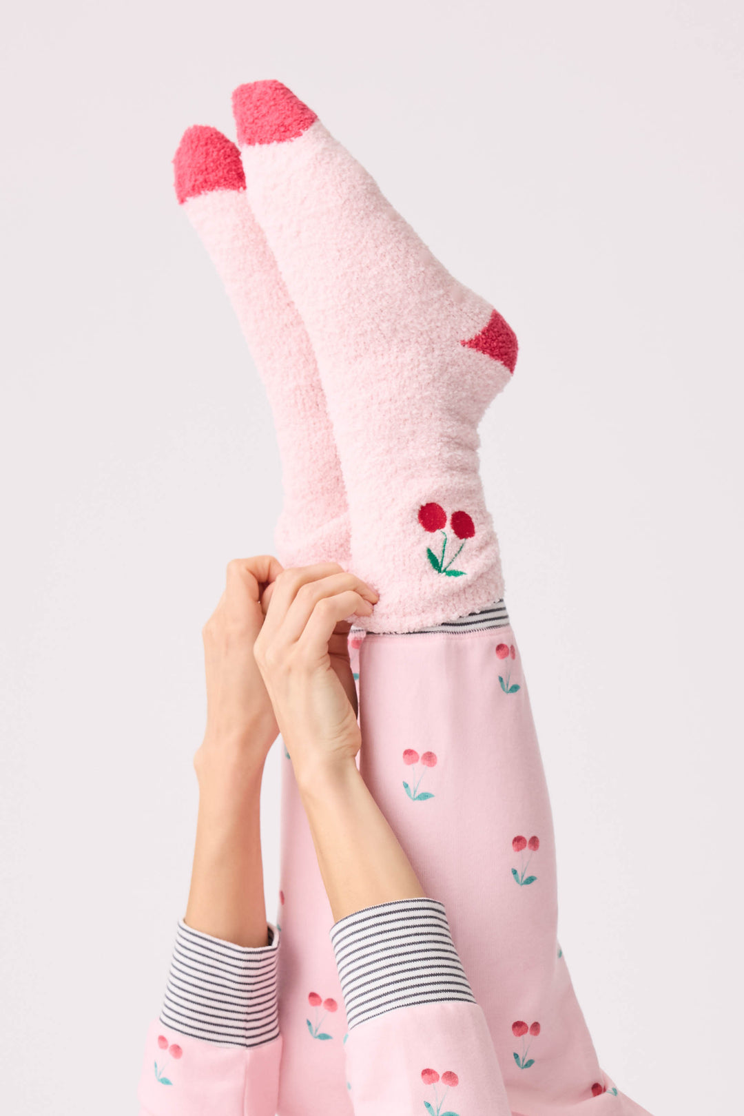 Women's pale pink and red socks with cherry embroidery.