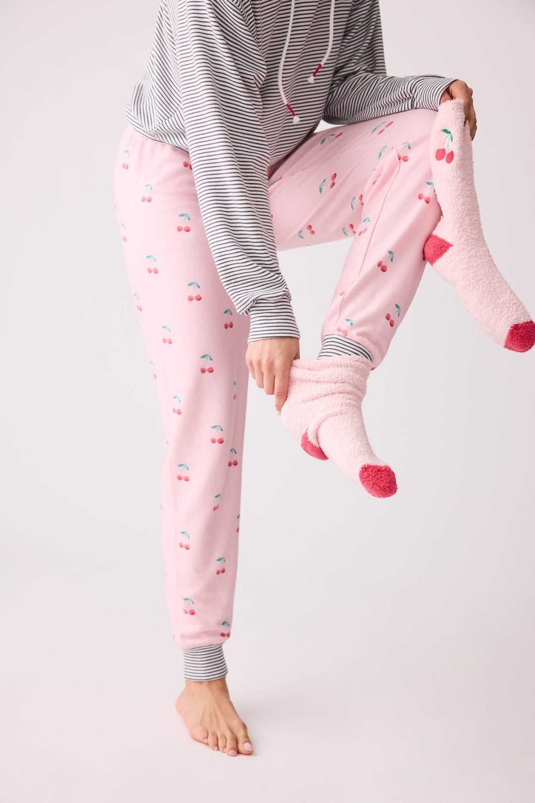 Women's pale pink and red socks with cherry embroidery.