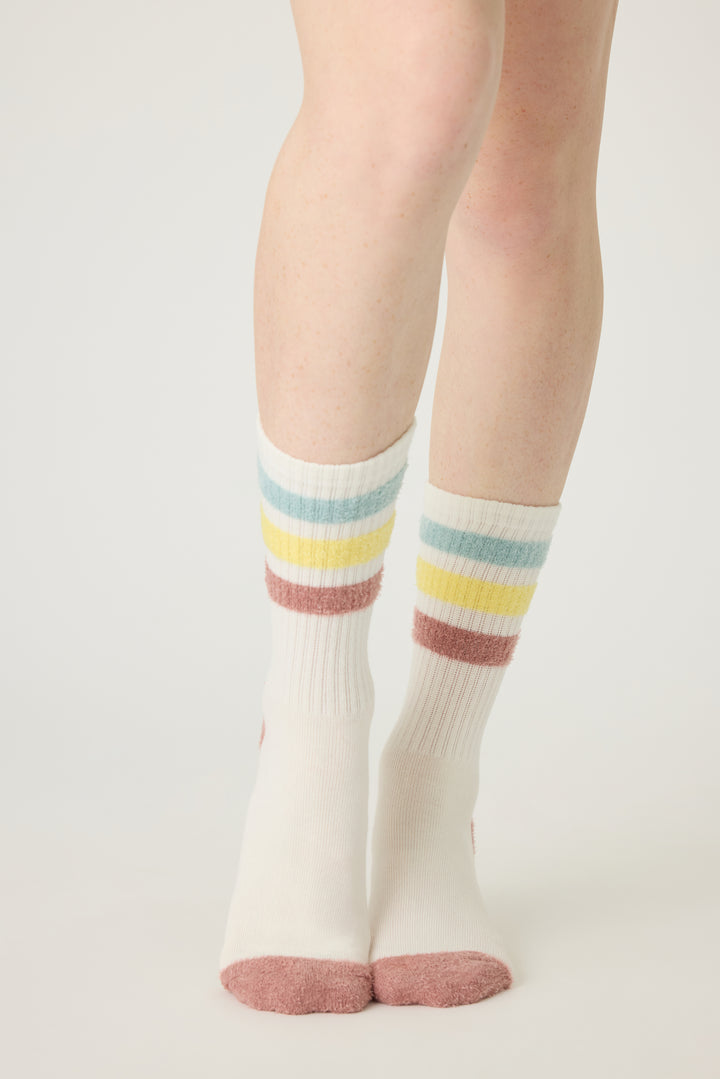 1-pack crew sock with feather yarn pastel stripes. Women & girls ivory sock with gripper soles.