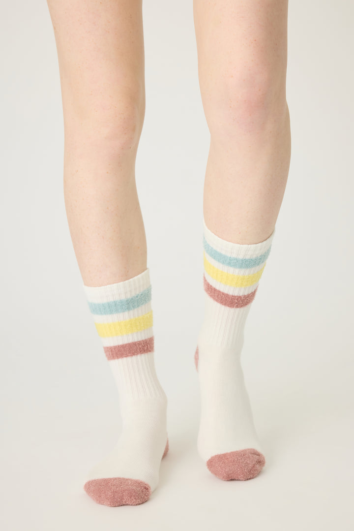 1-pack crew sock with feather yarn pastel stripes. Women & girls ivory sock with gripper soles.