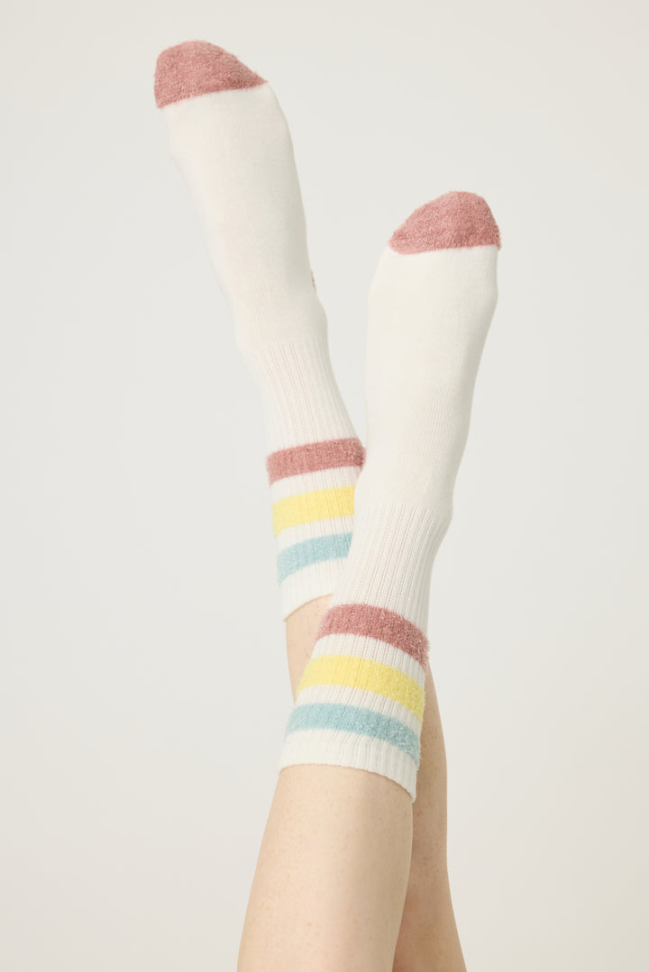 1-pack crew sock with feather yarn pastel stripes. Women & girls ivory sock with gripper soles.