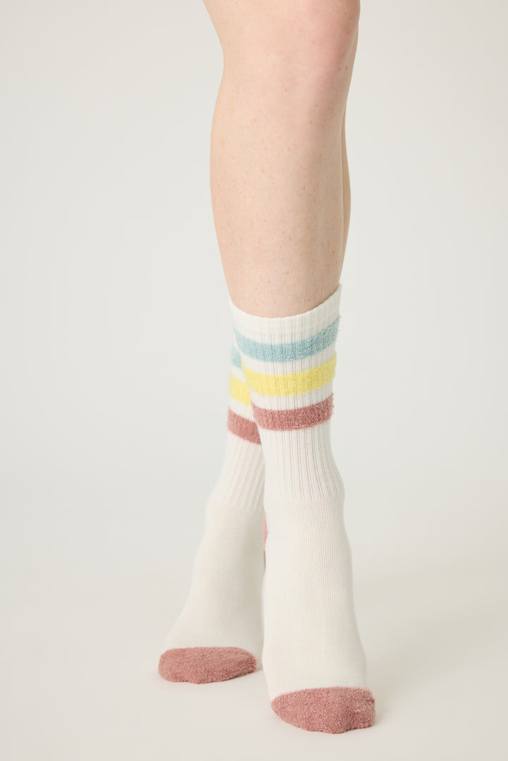 1-pack crew sock with feather yarn pastel stripes. Women & girls ivory sock with gripper soles.