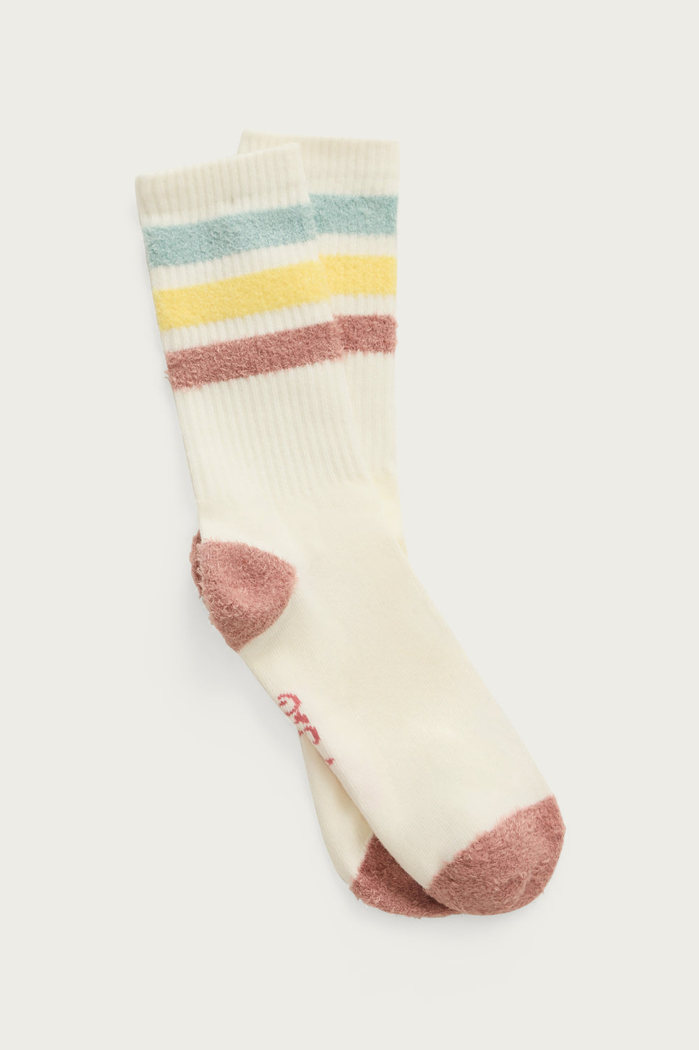 1-pack crew sock with feather yarn pastel stripes. Women & girls ivory sock with gripper soles.