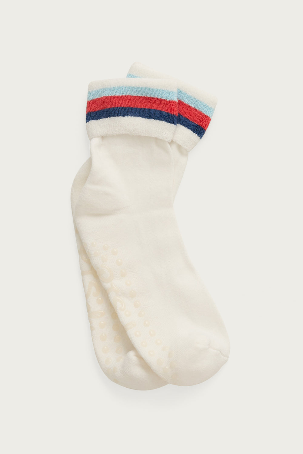 1-pack turn-cuff ankle sock. Women's & girls' terry sock in ivory with multi-stripes on cuff. Grippers on sole.