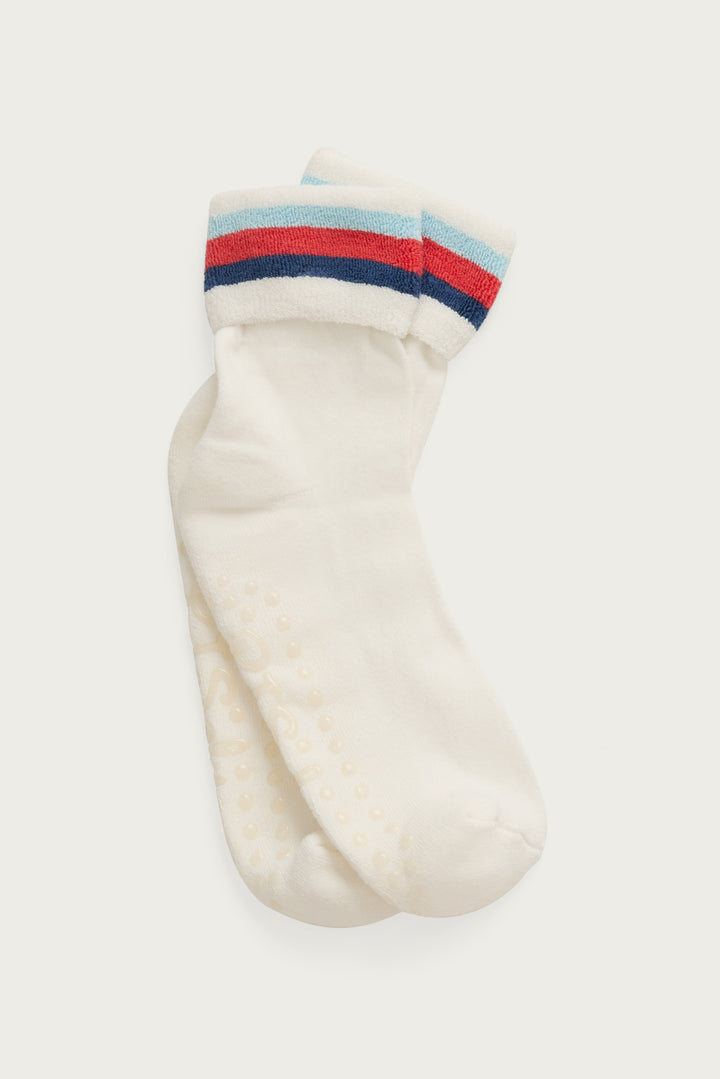 1-pack turn-cuff ankle sock. Women's & girls' terry sock in ivory with multi-stripes on cuff. Grippers on sole.