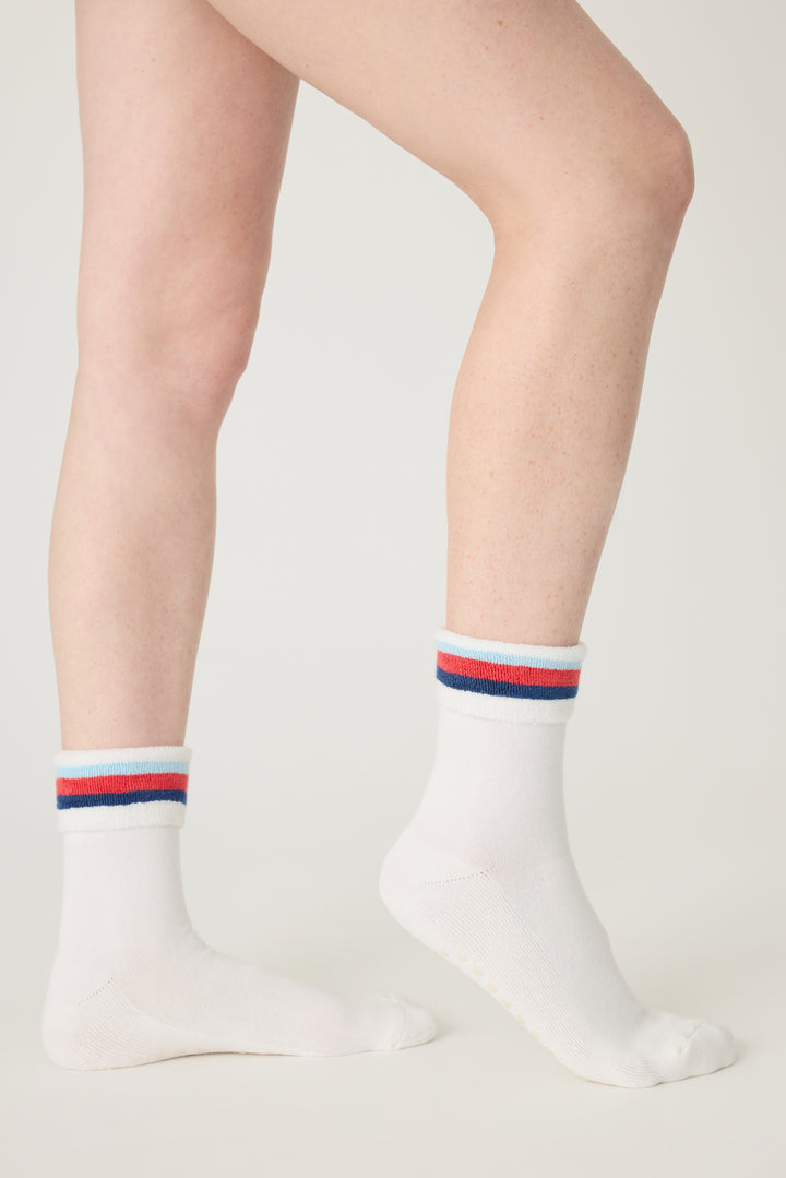 1-pack turn-cuff ankle sock. Women's & girls' terry sock in ivory with multi-stripes on cuff. Grippers on sole.
