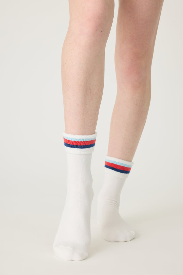 1-pack turn-cuff ankle sock. Women's & girls' terry sock in ivory with multi-stripes on cuff. Grippers on sole.