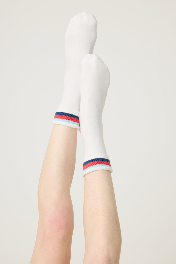 1-pack turn-cuff ankle sock. Women's & girls' terry sock in ivory with multi-stripes on cuff. Grippers on sole.