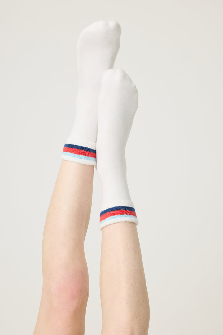 1-pack turn-cuff ankle sock. Women's & girls' terry sock in ivory with multi-stripes on cuff. Grippers on sole.