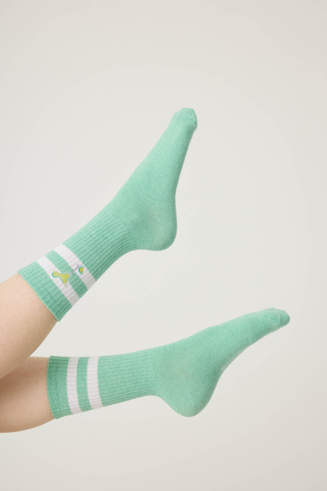1-pack crew sock. Women's light green socks with Margarita glass design.
