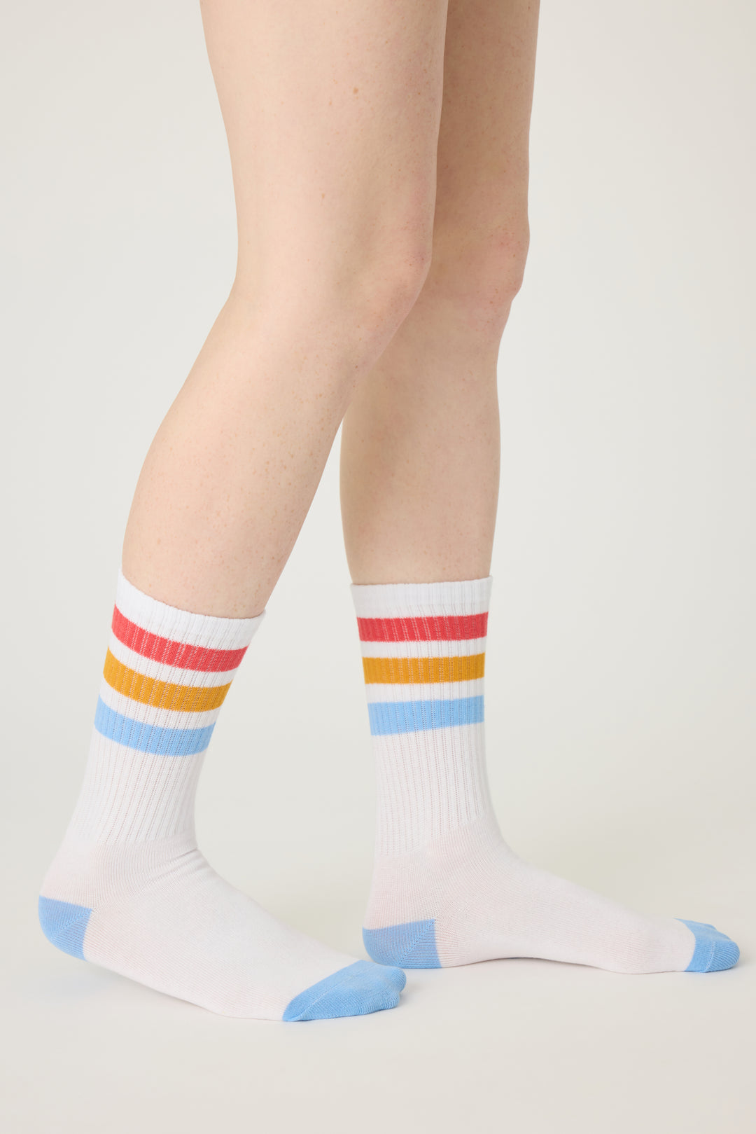 1-pack crew socks. Women's & girls' ivory socks w blue-red-gold stripes.