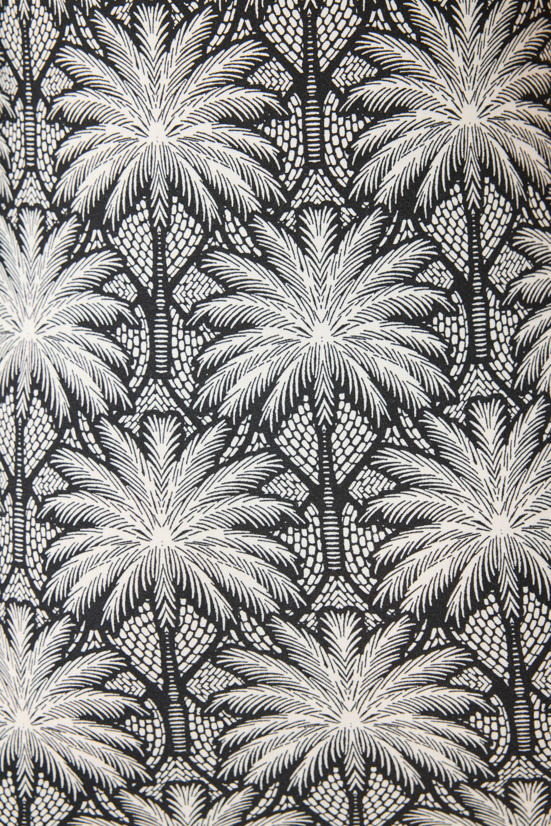 Women's black & ivory palm print midi-dress in modal. Semi-fitted with side slit hem.