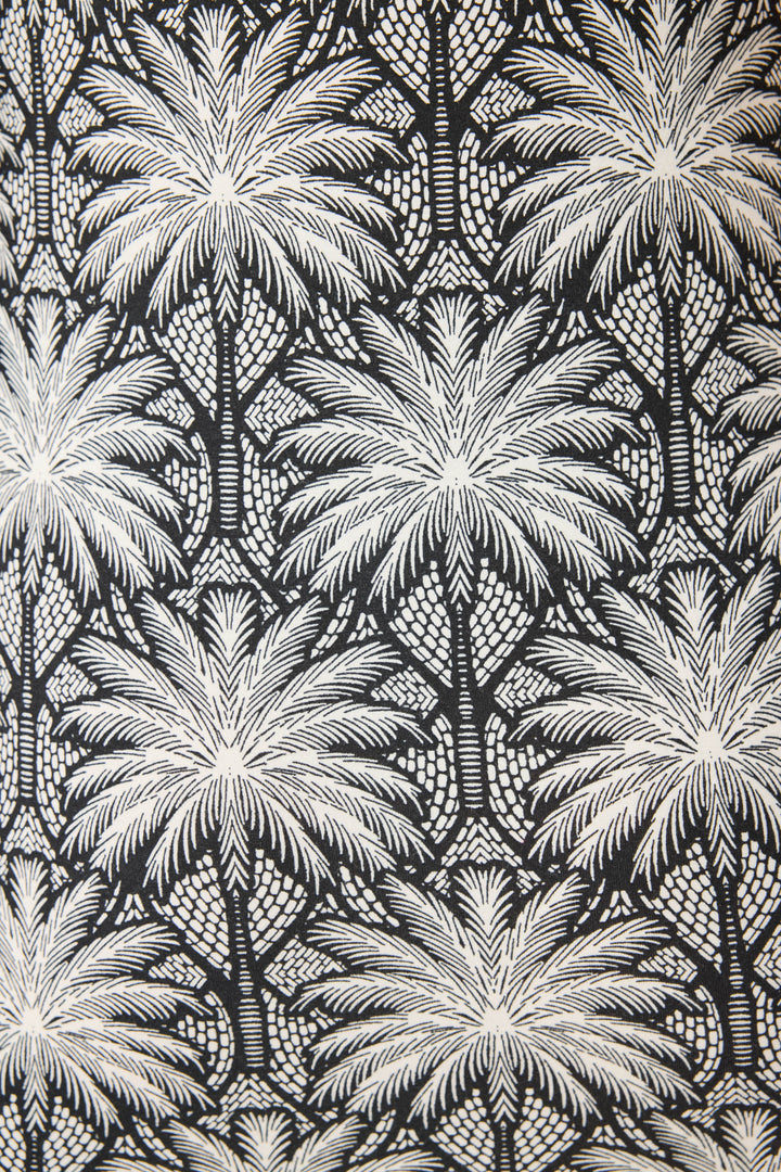 Women's black & ivory palm print midi-dress in modal. Semi-fitted with side slit hem.