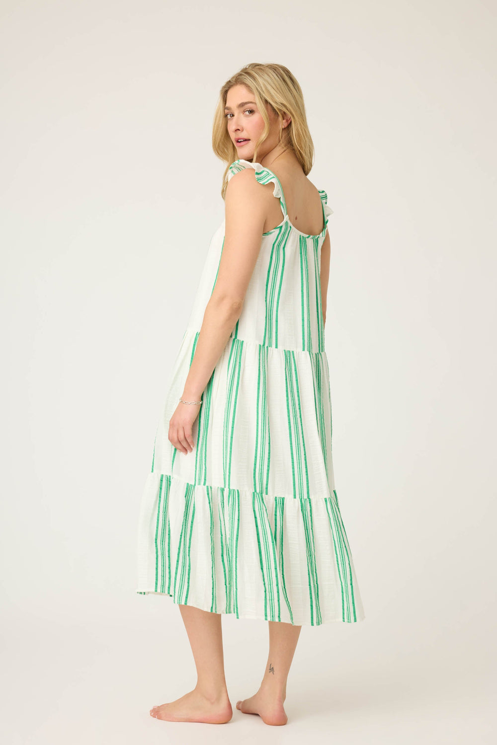 Women's green & white striped midi-length dress in cotton woven gauze. With pockets & ruffled straps.