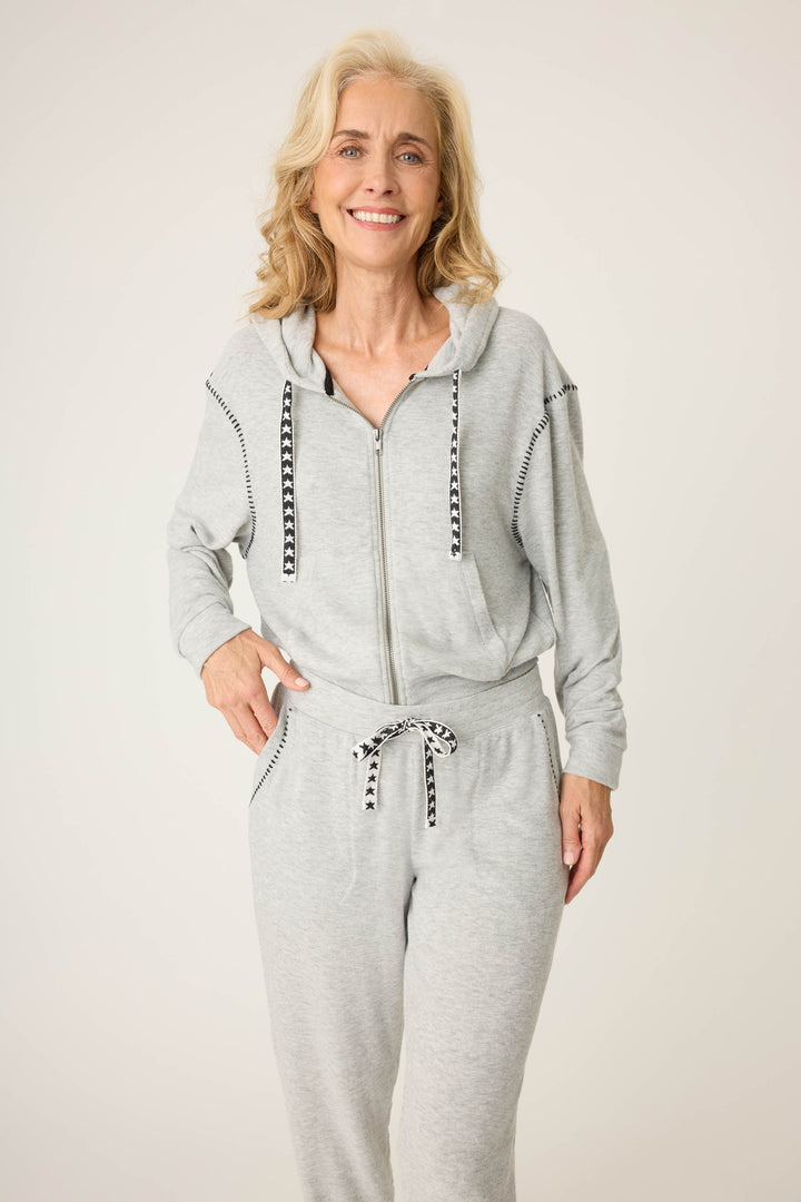 Women's grey zip up hoodie with star embroidery on drawcord.
