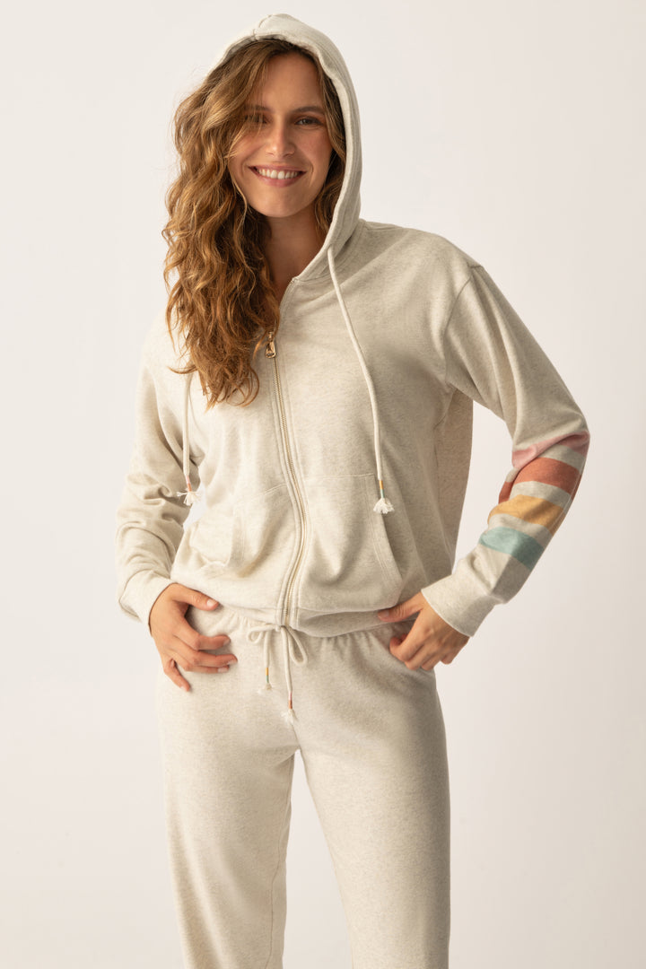 Women's zip hoody in oatmeal with graphic stripe print on sleeve. Lower front pockets.