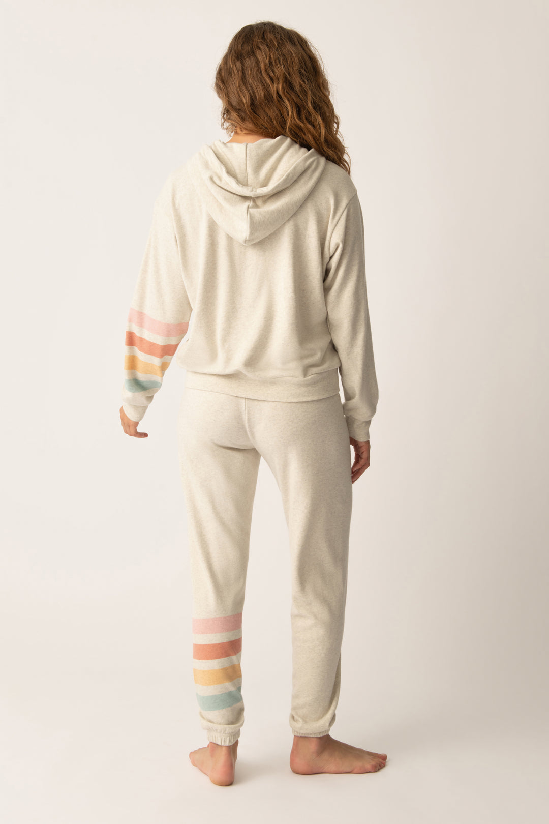 Women's zip hoody in oatmeal with graphic stripe print on sleeve. Lower front pockets.