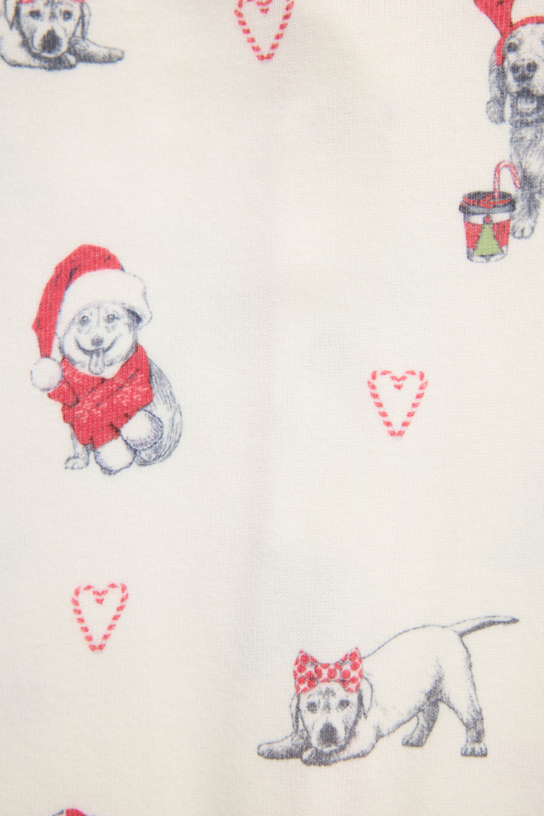 Infant's white romper with holiday dog with red hats pattern.