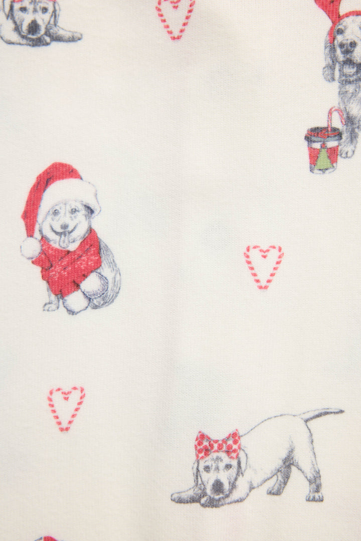 Infant's white romper with holiday dog with red hats pattern.