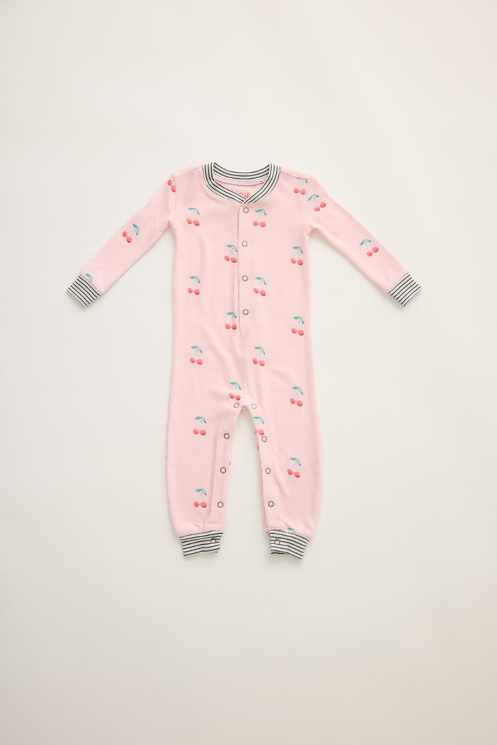 Infant's pale pink romper with cherry pattern.