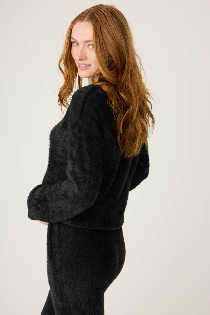 Women's black feather knit long sleeve top.