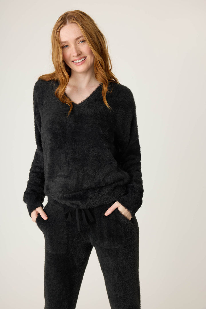 Women's black feather knit long sleeve top.