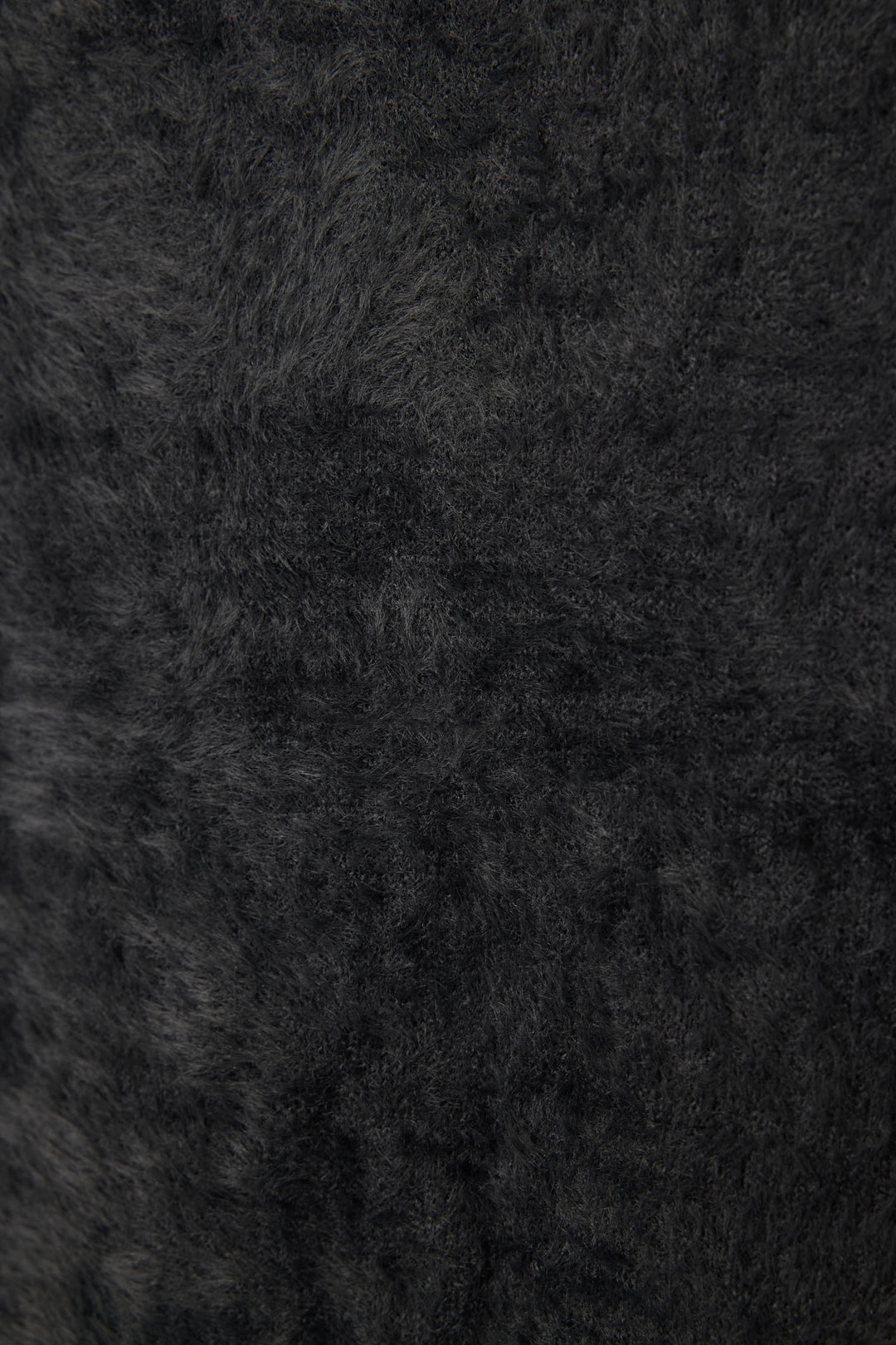 Women's black feather knit long sleeve top.