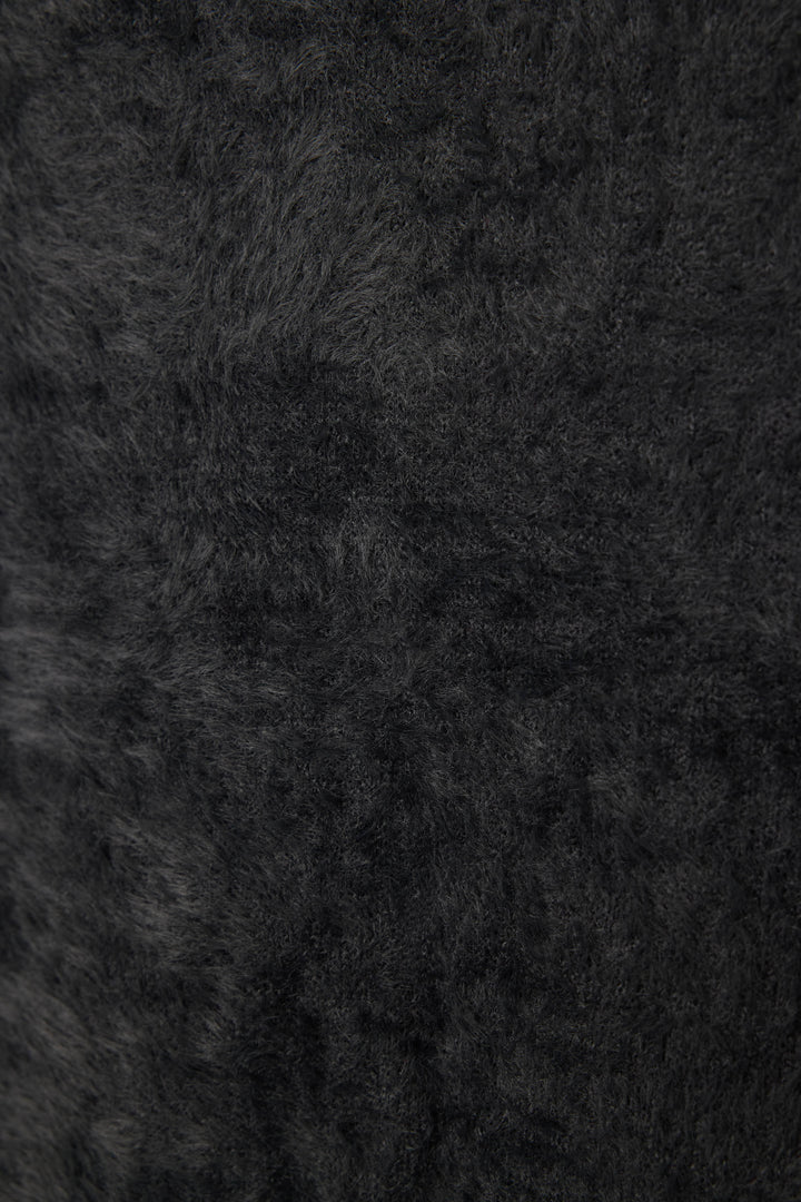 Women's black feather knit long sleeve top.