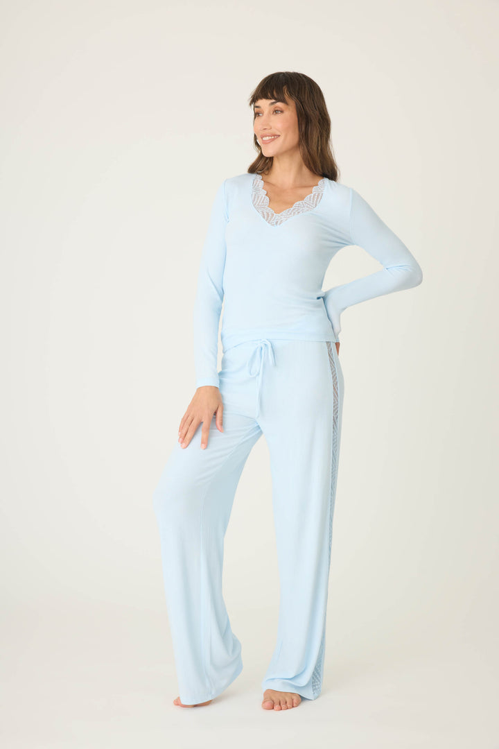 Women's fitted blue long sleeve top in micro-rib knit. With lace inset neckline & back detail.