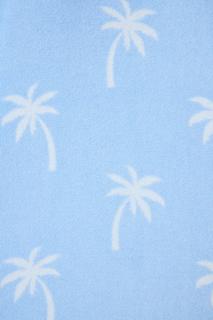 Women's blue palm-print lounge top in vintage terry. Open hem with rib cuff.