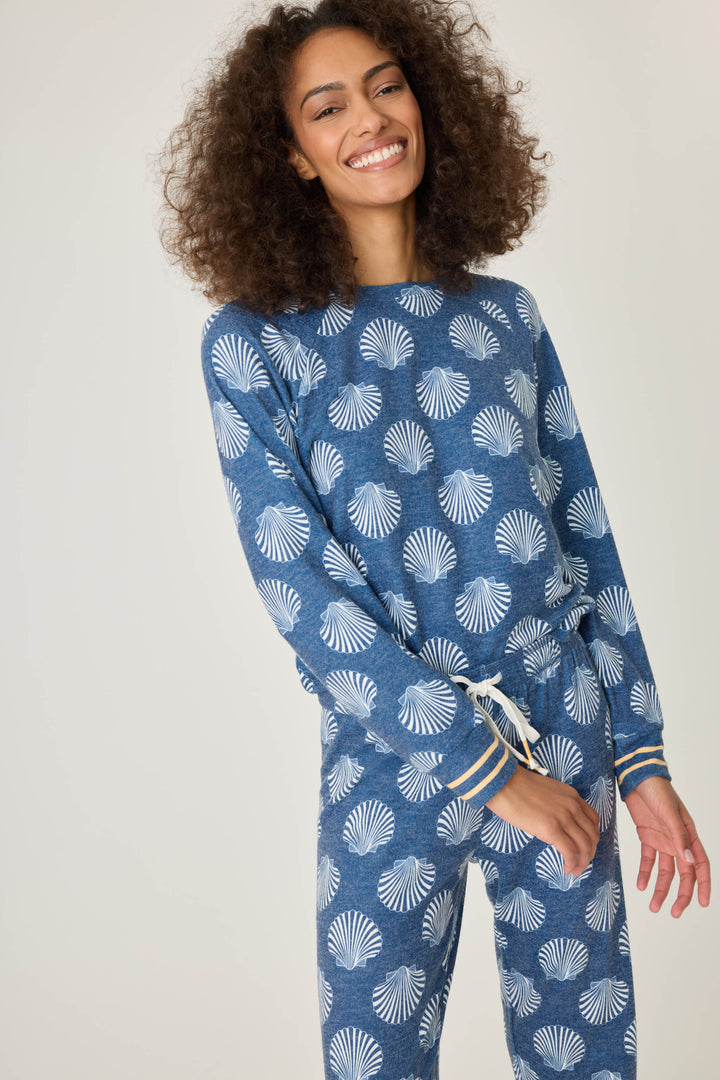 Navy shell-printed lounge top for women. Long sleeve with banded hem & gold striped sleeve cuffs.