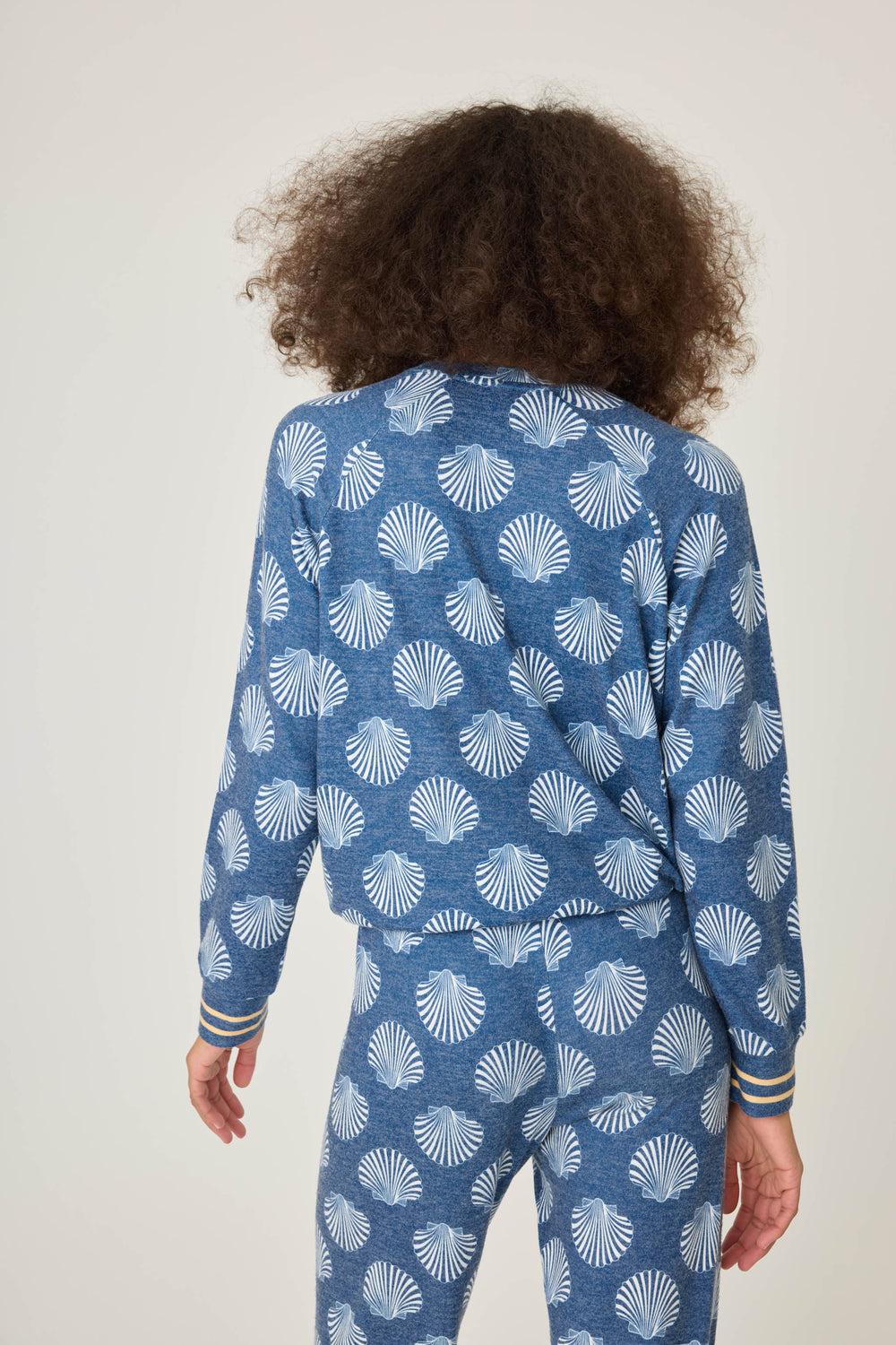 Navy shell-printed lounge top for women. Long sleeve with banded hem & gold striped sleeve cuffs.