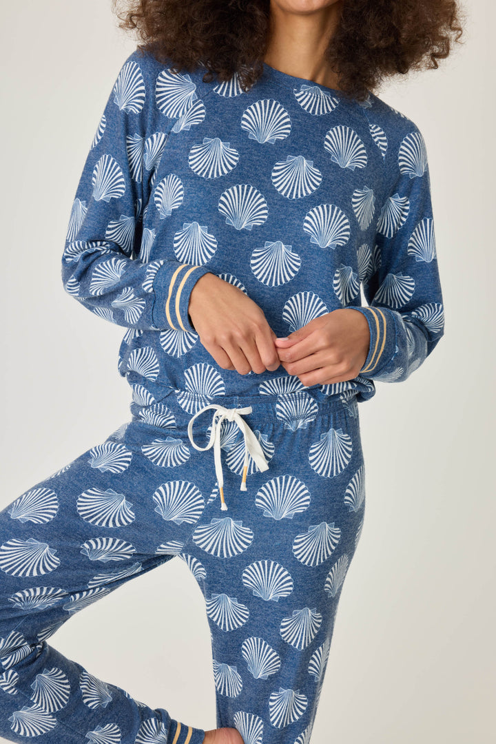 Navy shell-printed lounge top for women. Long sleeve with banded hem & gold striped sleeve cuffs.