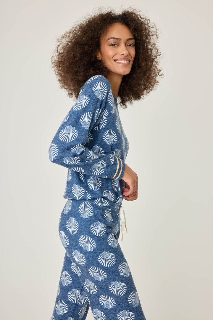 Navy shell-printed lounge top for women. Long sleeve with banded hem & gold striped sleeve cuffs.