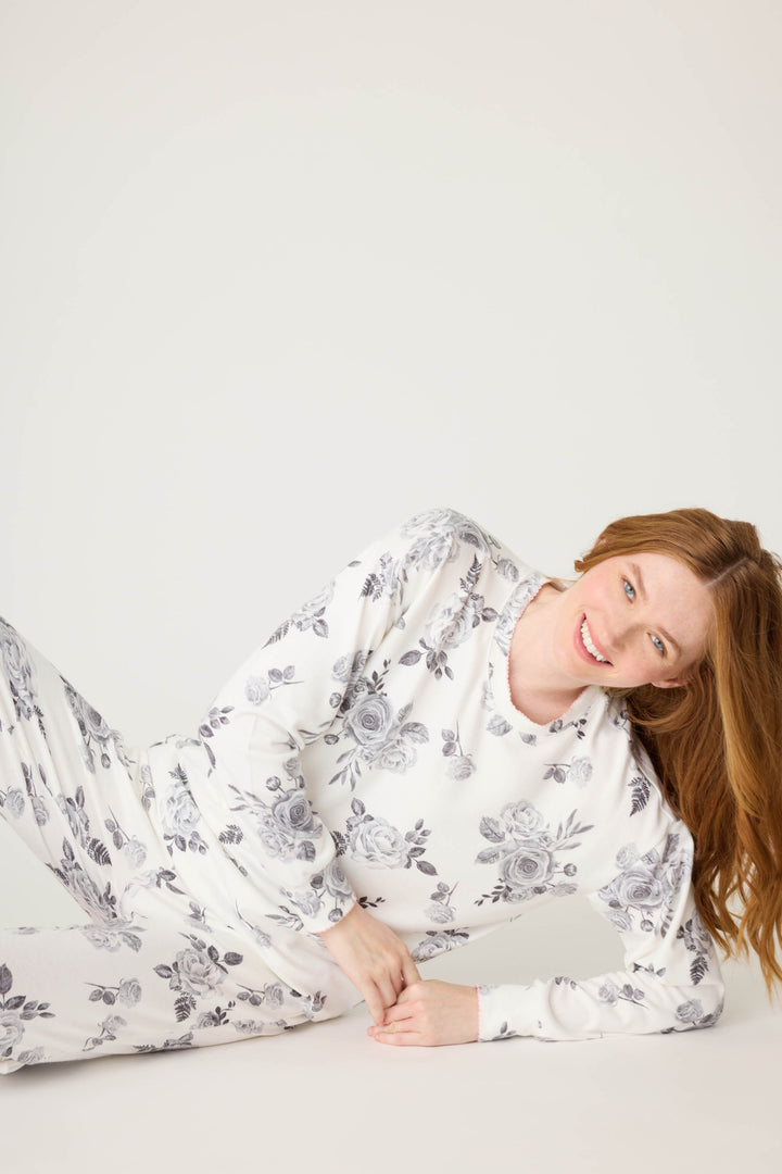 Women's white pj top with black rose design. 