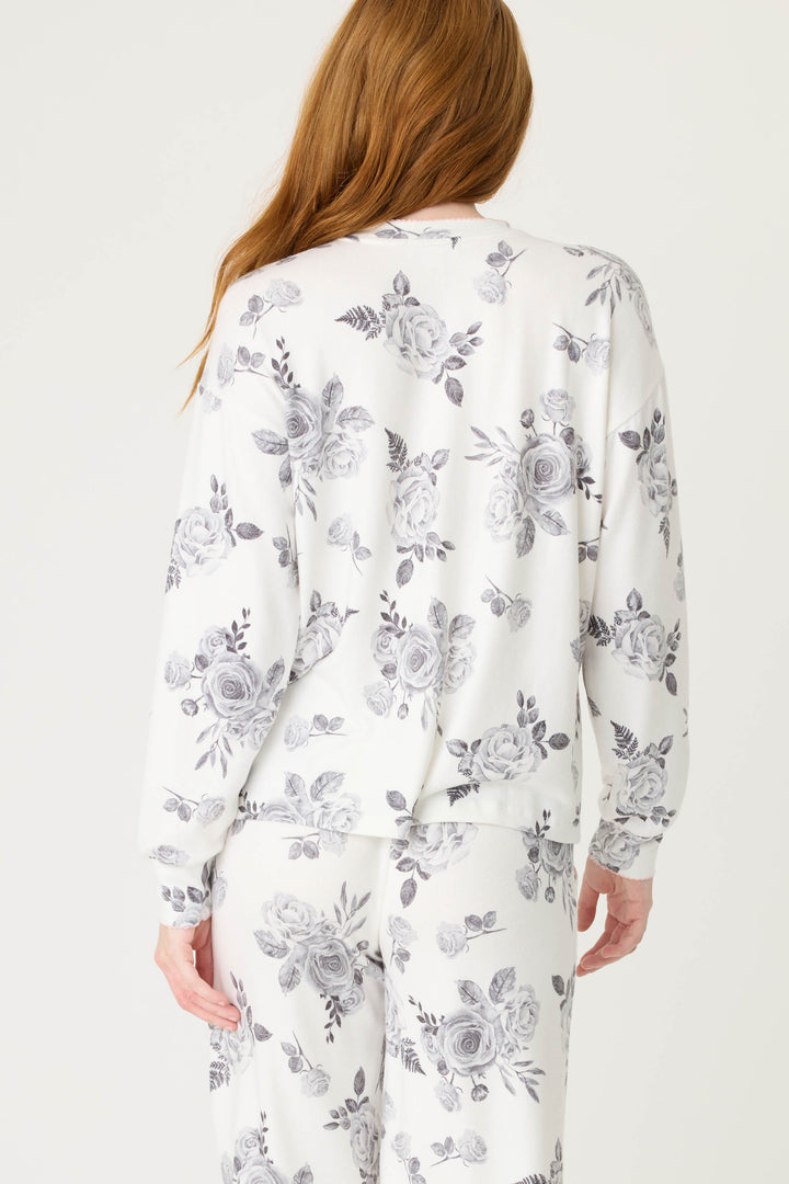 Women's white pj top with black rose design. 
