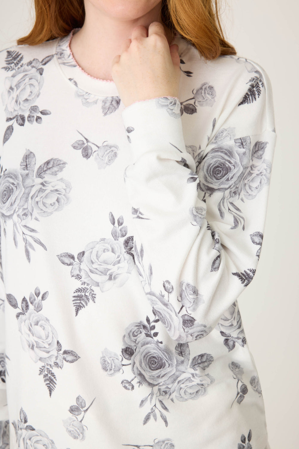Women's white pj top with black rose design. 