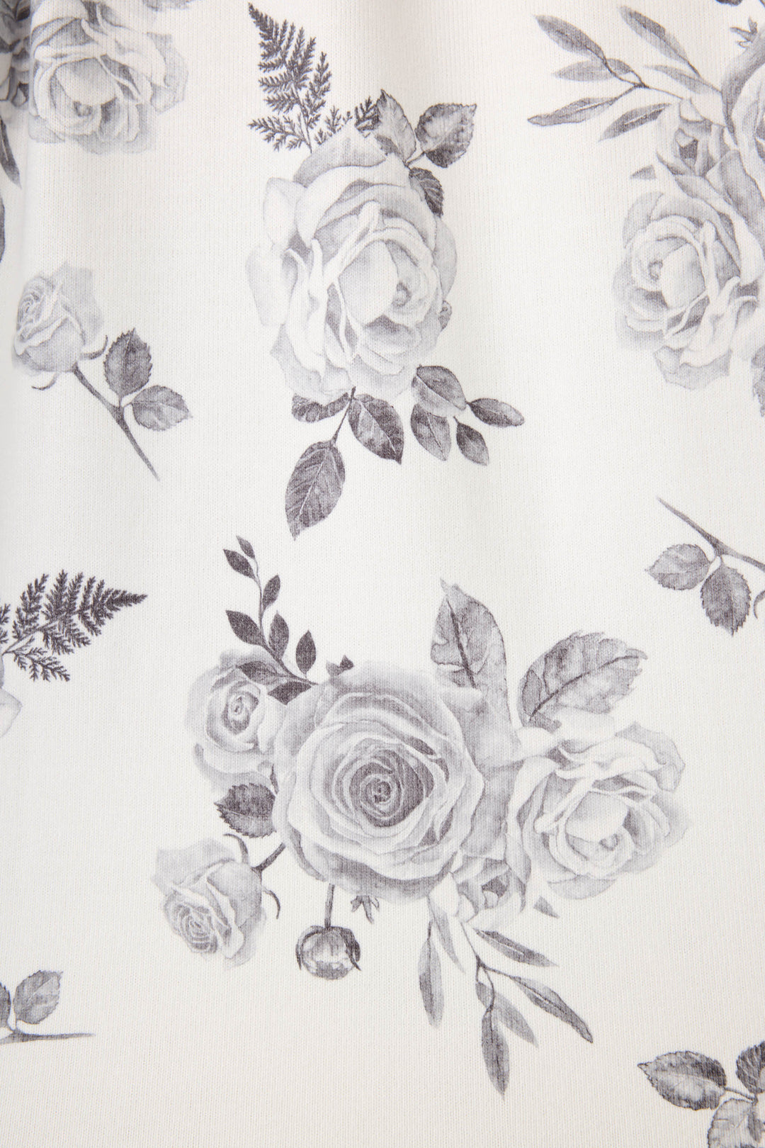Women's white pj top with black rose design. 