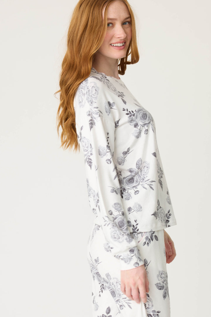 Women's white pj top with black rose design. 