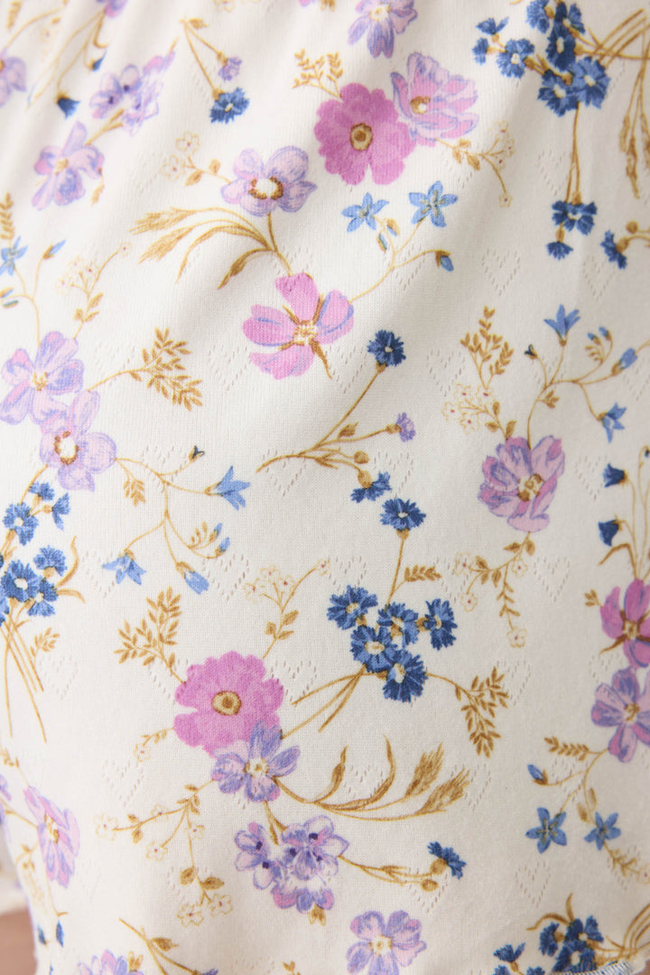 Women's ivory v-neck long sleeve pj top with floral pattern.