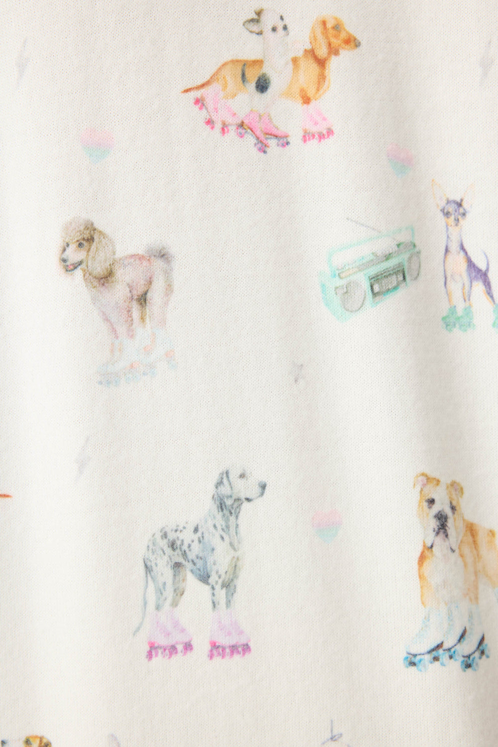 Women's ivory lounge top with dogs on rollerskates pattern. Relaxed fit with banded bottom.
