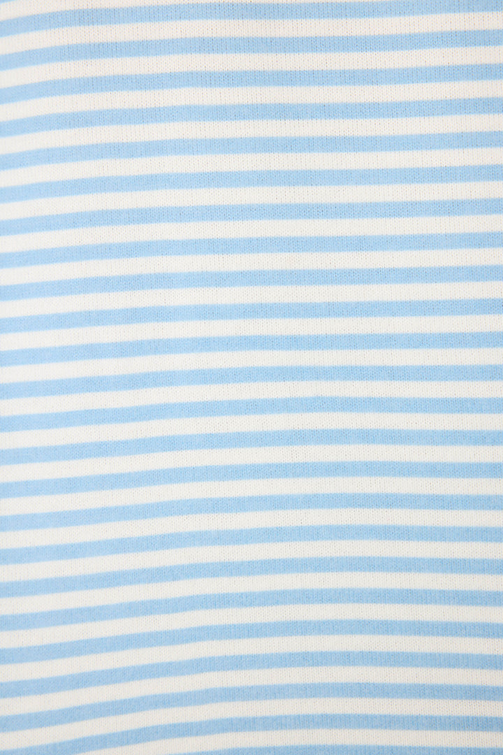 Women's ivory & blue striped V-neck top with bright pink contrast stitching at raglan sleeves. Banded hem.